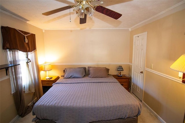 carpeted bedroom featuring crown molding, a textured ceiling, and ceiling fan