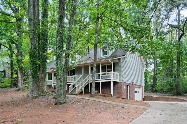 view of front facade featuring a garage and covered porch