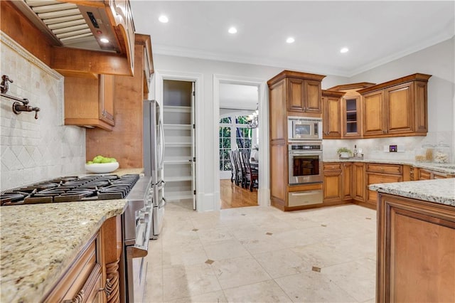 kitchen featuring a warming drawer, ornamental molding, appliances with stainless steel finishes, brown cabinetry, and light stone countertops