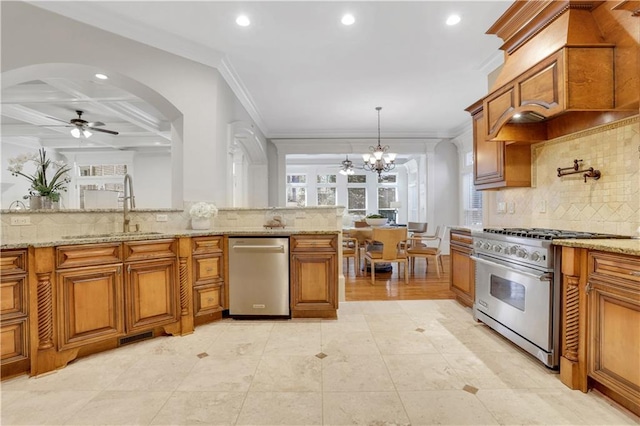 kitchen featuring a sink, brown cabinets, and stainless steel appliances
