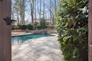 outdoor pool with a patio