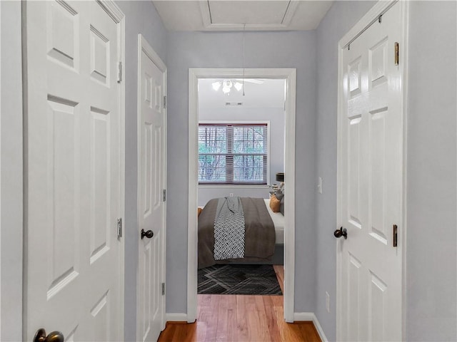 1649 Southgate Mill Dr, Duluth, GA 30096 - hallway featuring baseboards, wood finished floors, and attic access
