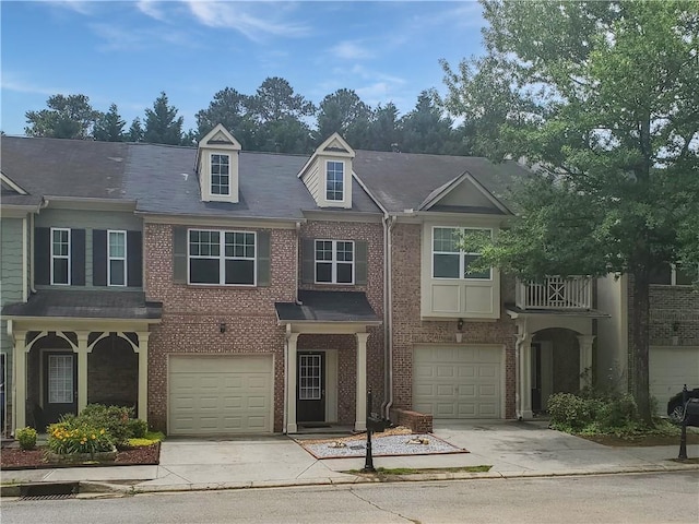 1649 Southgate Mill Dr, Duluth, GA 30096 - view of property with concrete driveway, an attached garage, and brick siding