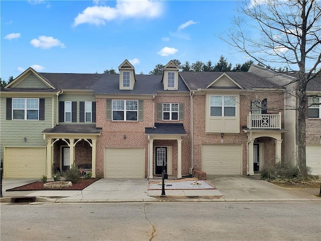1649 Southgate Mill Dr, Duluth, GA 30096 - view of property featuring driveway, a garage, and brick siding