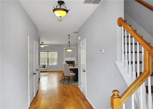 1649 Southgate Mill Dr, Duluth, GA 30096 - hall featuring stairs, light wood finished floors, and baseboards