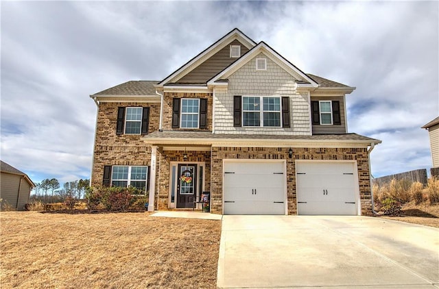 craftsman inspired home with brick siding, concrete driveway, and an attached garage