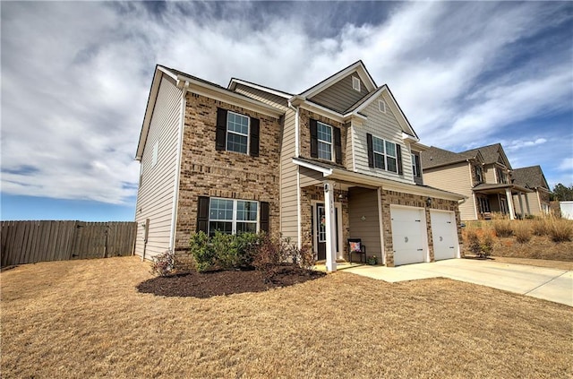 view of front of property with driveway, a garage, and fence