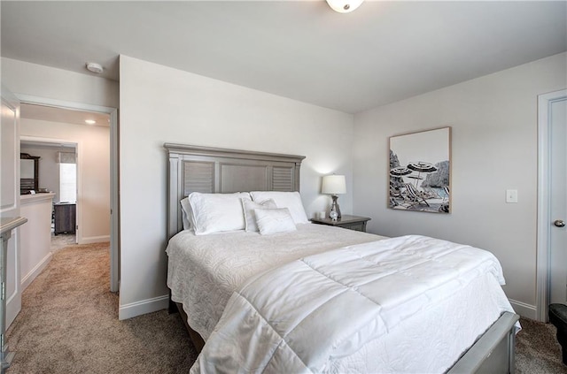 bedroom with baseboards and carpet floors