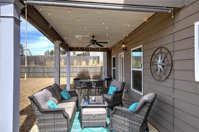 view of patio / terrace featuring outdoor lounge area, outdoor dining space, fence, and ceiling fan