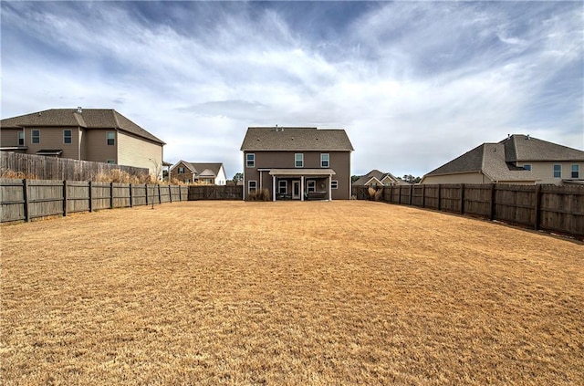 view of yard with a residential view and a fenced backyard