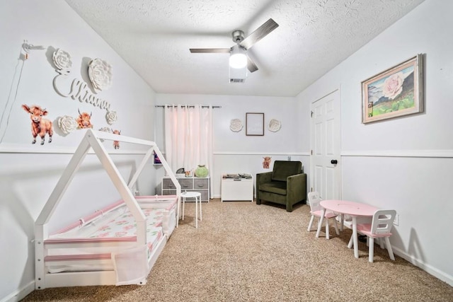 565 Saint James Ct, Lawrenceville, GA 30044 - bedroom with ceiling fan, carpet floors, and a textured ceiling