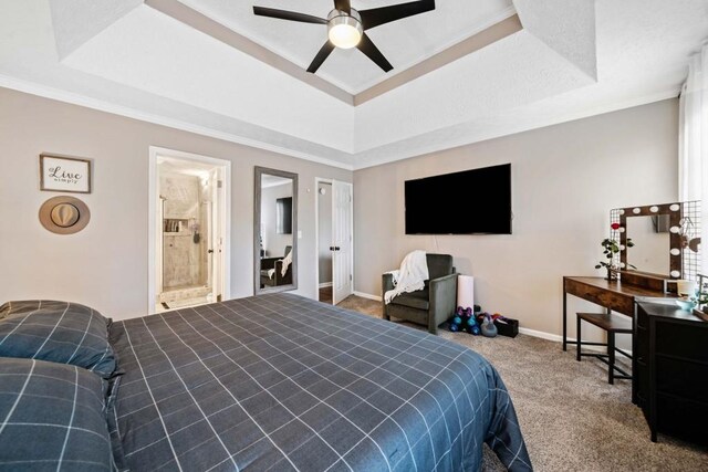 565 Saint James Ct, Lawrenceville, GA 30044 - carpeted bedroom featuring a raised ceiling, crown molding, ceiling fan, and ensuite bath