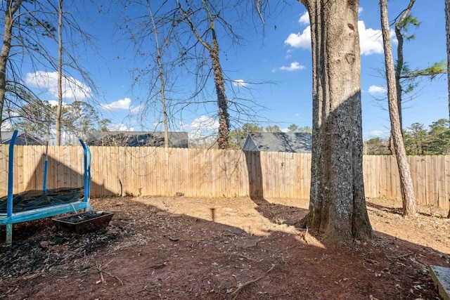 565 Saint James Ct, Lawrenceville, GA 30044 - view of yard featuring a trampoline