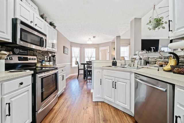 565 Saint James Ct, Lawrenceville, GA 30044 - kitchen featuring white cabinetry, sink, and stainless steel appliances