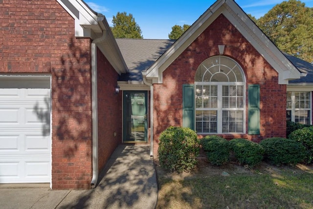 doorway to property featuring a garage