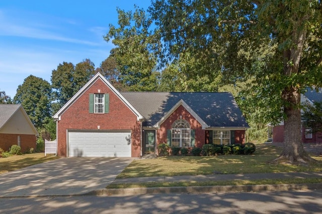 view of front of property with a front lawn and a garage