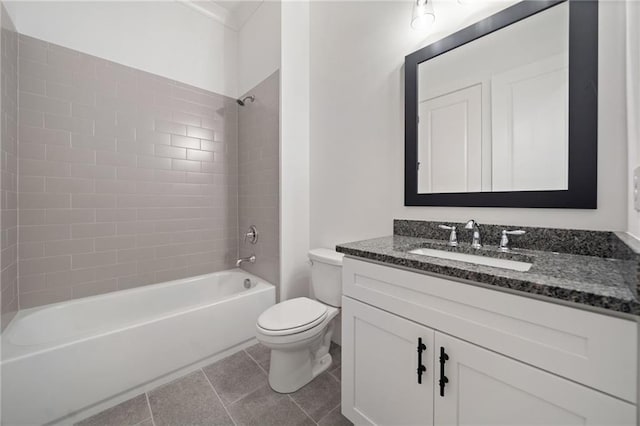 full bathroom with tile patterned floors, toilet, tiled shower / bath combo, and vanity