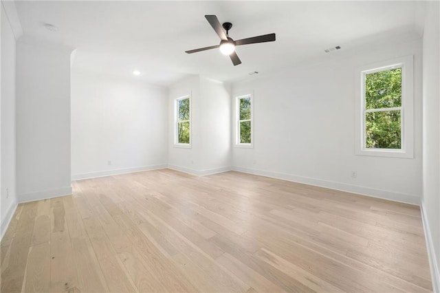 spare room with ceiling fan and light hardwood / wood-style flooring