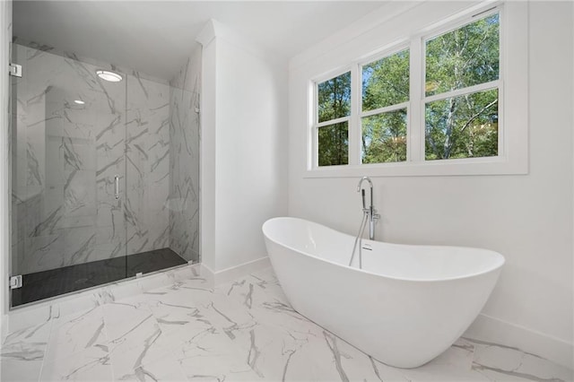 bathroom featuring shower with separate bathtub