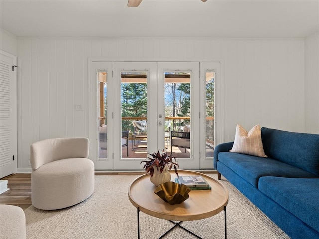 living area featuring french doors and wood finished floors