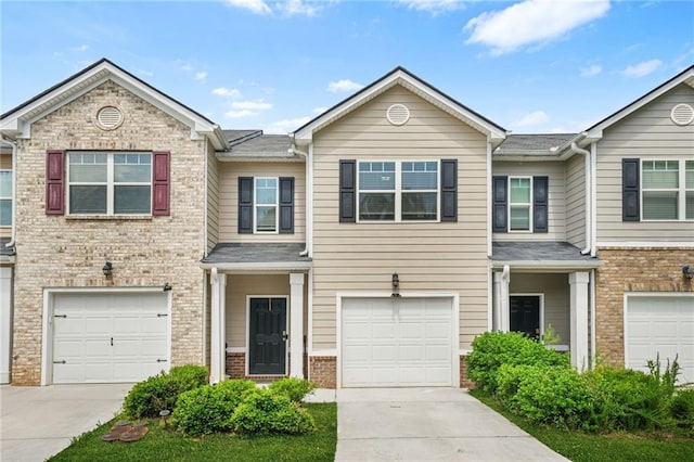 4076 Sonoma Wood Trl, Decatur, GA 30034 - townhome / multi-family property featuring driveway, brick siding, and an attached garage