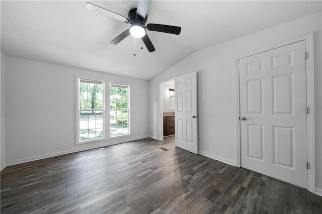 68 Wagon Trail Cir, Dallas, GA 30132 - unfurnished bedroom featuring dark wood finished floors, vaulted ceiling, and ceiling fan