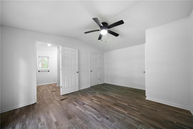 68 Wagon Trail Cir, Dallas, GA 30132 - unfurnished bedroom featuring lofted ceiling, dark wood finished floors, and a ceiling fan