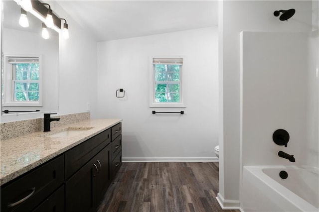 68 Wagon Trail Cir, Dallas, GA 30132 - full bath with vanity, wood finished floors, healthy amount of natural light, and shower / bathtub combination