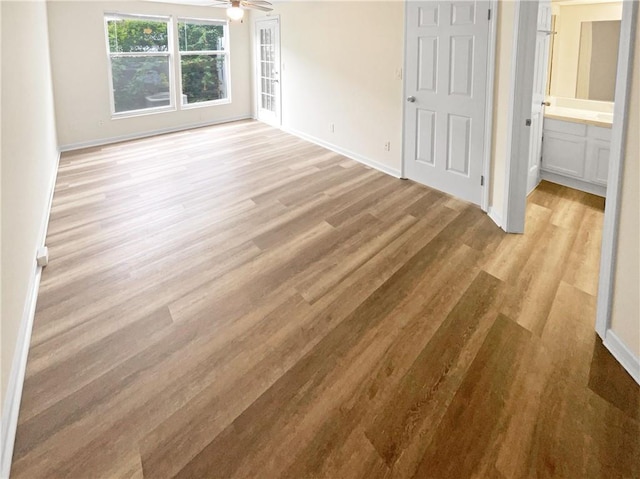 unfurnished room featuring ceiling fan and light hardwood / wood-style floors