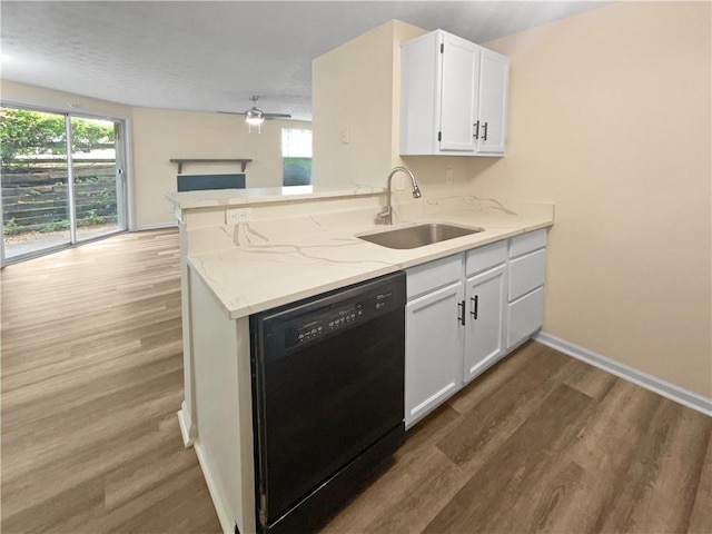 kitchen with sink, white cabinets, black dishwasher, hardwood / wood-style flooring, and kitchen peninsula