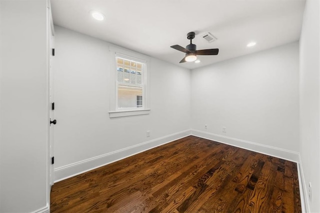 spare room featuring recessed lighting, visible vents, dark wood-type flooring, a ceiling fan, and baseboards