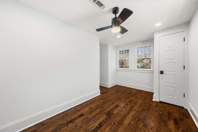 unfurnished bedroom featuring visible vents, baseboards, dark wood finished floors, a ceiling fan, and recessed lighting