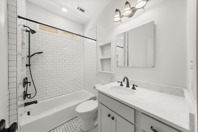 full bathroom with shower / bath combination, visible vents, vanity, and toilet