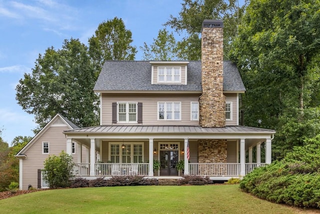 view of front of home with a front yard and covered porch