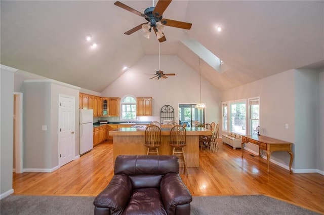 1775 Whooping Creek Rd, Carrollton, GA 30116 - living area featuring ceiling fan, high vaulted ceiling, a chandelier, a skylight, and healthy amount of natural light