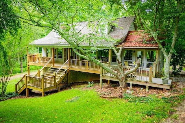 1775 Whooping Creek Rd, Carrollton, GA 30116 - back of property featuring a lawn, a shingled roof, stairway, and a wooden deck