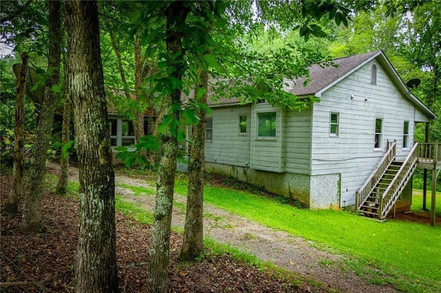 1775 Whooping Creek Rd, Carrollton, GA 30116 - view of side of home with stairs, a yard, a shingled roof, and a wooden deck