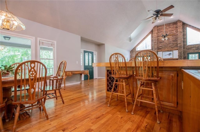 1775 Whooping Creek Rd, Carrollton, GA 30116 - dining room with light wood-type flooring, ceiling fan, plenty of natural light, and high vaulted ceiling