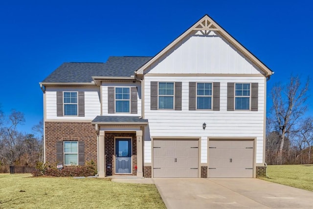 view of front of house with a garage and a front yard