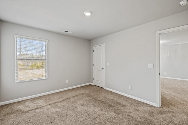 view of carpeted spare room