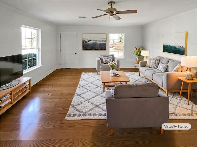 living room featuring hardwood / wood-style floors and ceiling fan