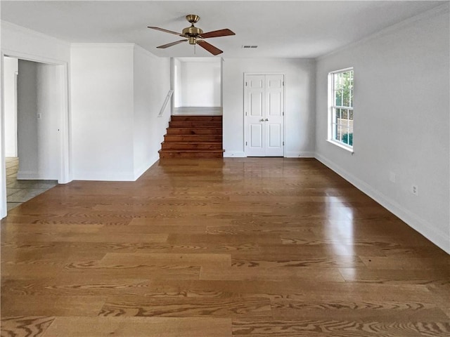 spare room with ceiling fan and dark hardwood / wood-style flooring