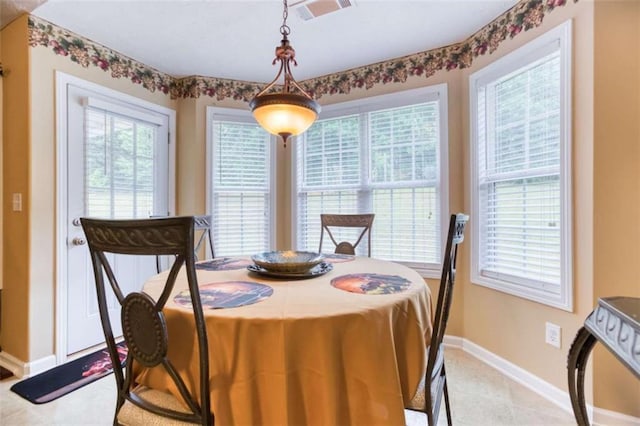 dining area with visible vents and baseboards