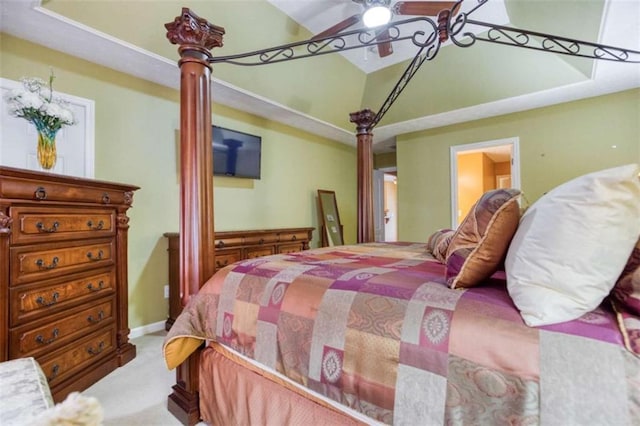 bedroom featuring baseboards, lofted ceiling, and carpet