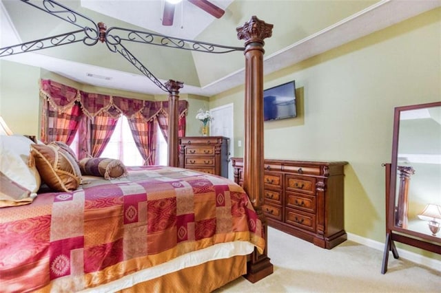 carpeted bedroom with a tray ceiling, visible vents, ceiling fan, and baseboards