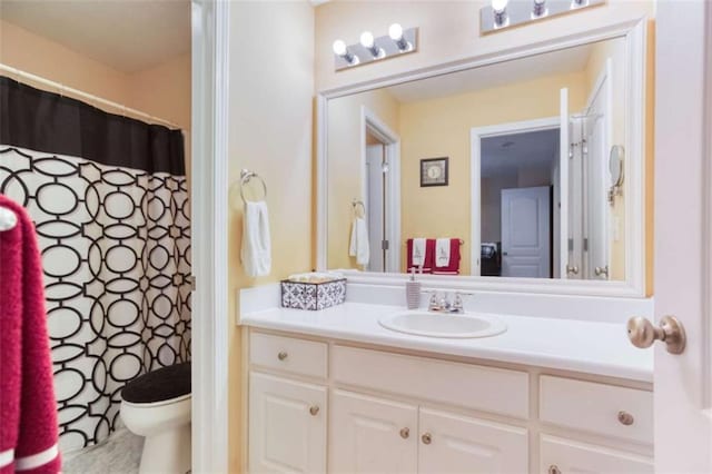 full bath with toilet and vanity