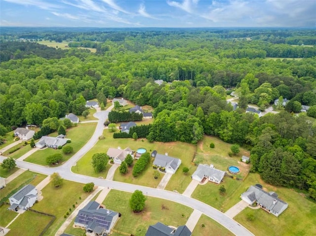 drone / aerial view with a view of trees