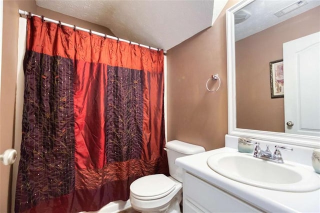 bathroom with visible vents, toilet, a shower with curtain, and vanity