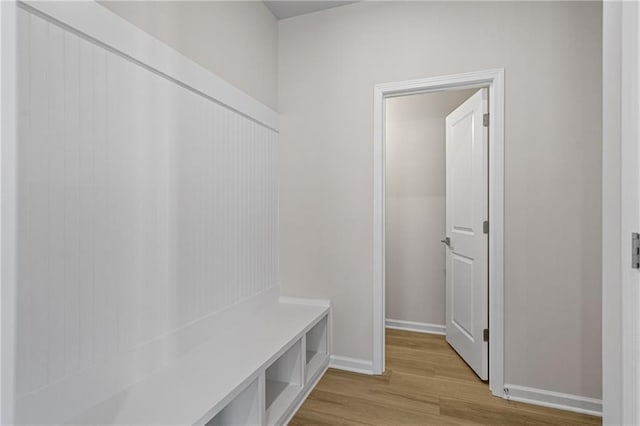 mudroom with baseboards and light wood-style flooring