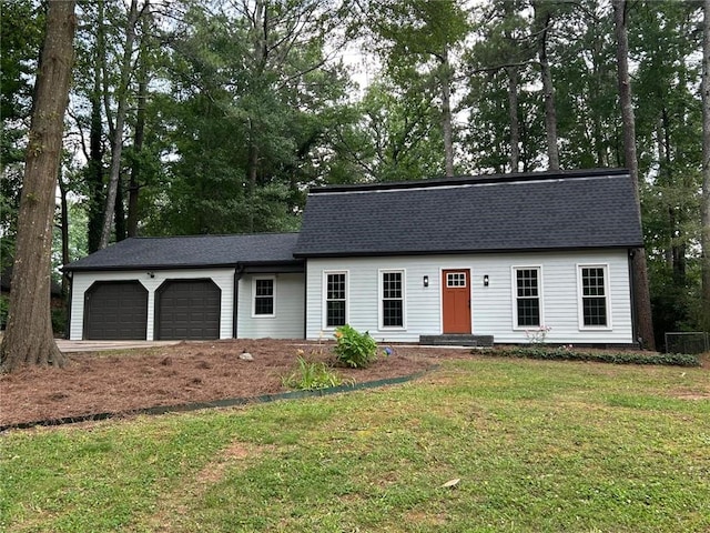 4617 Cedar Park Dr, Stone Mountain, GA 30083 - view of front of property with a garage, a front yard, and roof with shingles